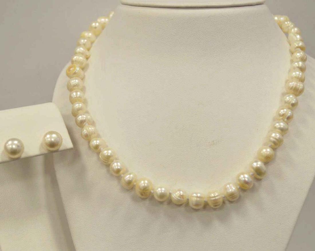 16" freshwater pearl necklace and earrings: Ladies 16" fresh water pearl necklace featuring 8-9mm baroque pearls in a creamy white color. Single knotted and finished with a gold toned lobster clasp. Also comes with a pair of matching 8-9mm stud