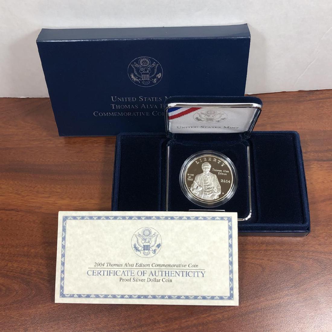2004 Thomas Edison Silver Proof Commem. $1: 2004 Thomas Alva Edison "Lightbulb" Silver Proof Commemorative $1, accompanied with its original Mint packaging and COA.