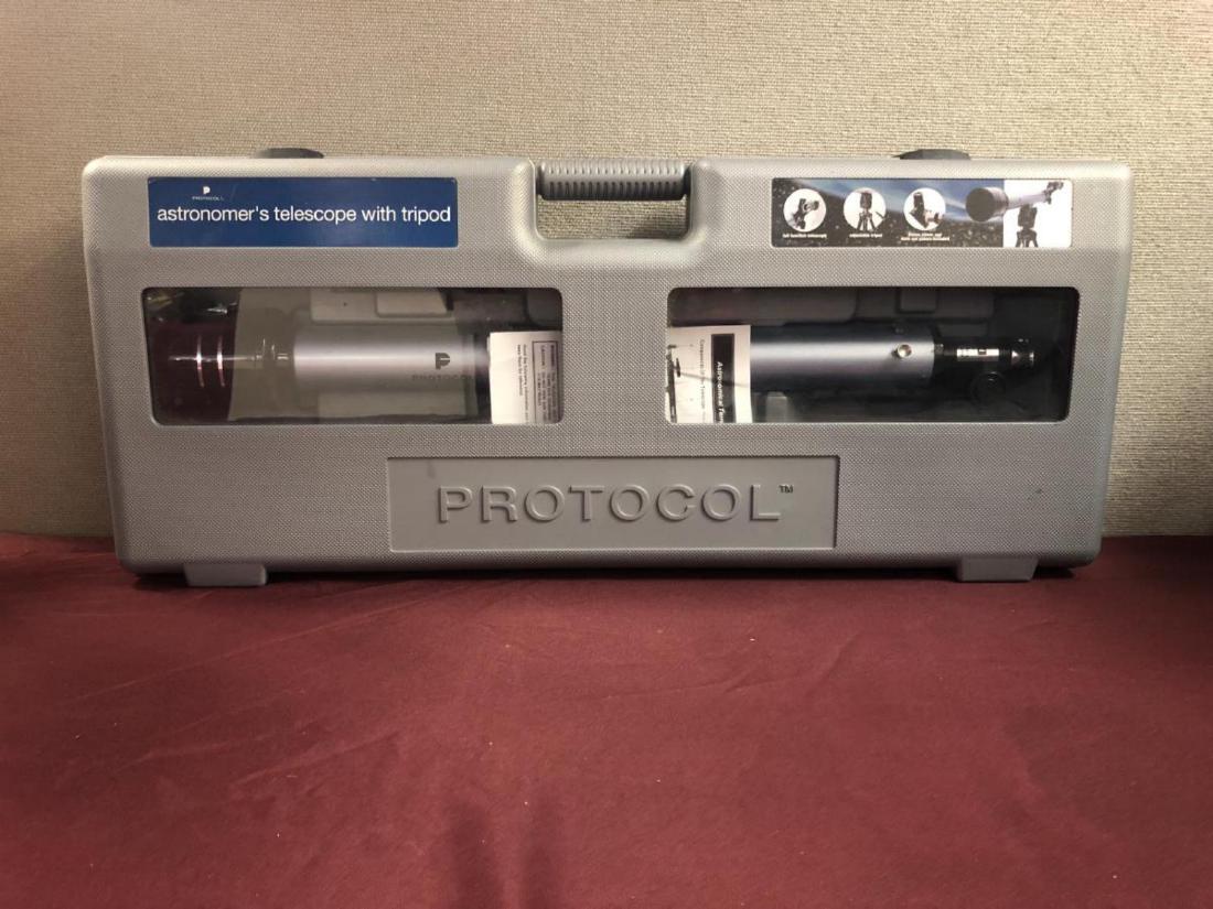 Astronomers Telescope 175x50mm by Protocol: Astronomers Terrestrial Tabletop Telescope 175x50mm with tripod by Protocol. Comes with sturdy hard plastic molded storage case and instruction booklet. Appears to have been just slightly used.
