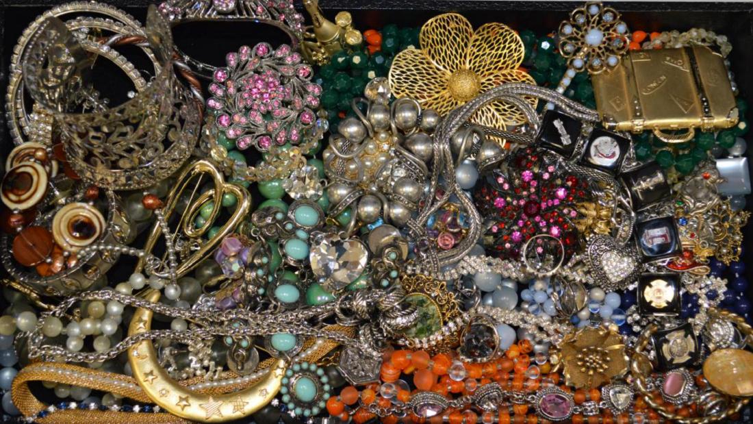 Large lot of costume jewelry: Large lot of costume jewelry including large floral cuff bracelet and brooches, fancy link bracelets, rheinstone necklace, beaded necklaces with matching earrings and more.
