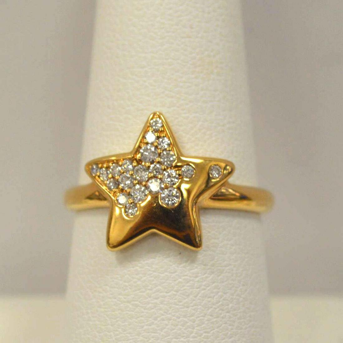 18kt rose gold diamond star ring: 18kt rose gold diamond star fashion ring featuring flush set round brilliant cut diamond weighing approx. 0.26ct. mounted on a star design. Finger size 7 1/4. Weight 5.5 grams. ZRDW22611-003