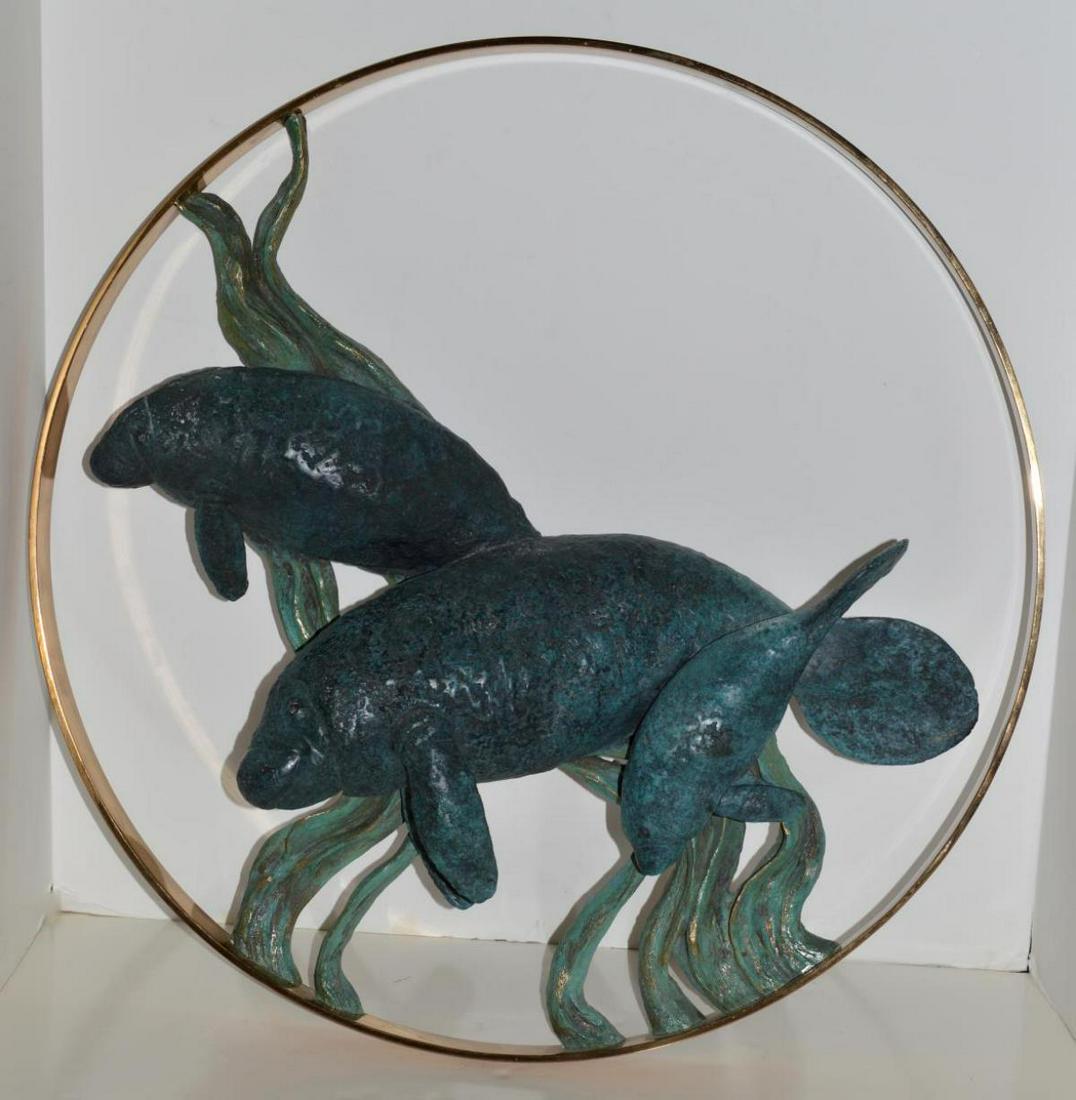 1992 Wyland Bronze Manatee Circle Sculpture: 1992 Robert Wyland Bronze Manatee Sculpture Titled "Manatee Circle of Life". Hand Signed & Numbered 78/300. Comes with COA. Printer/Foundry; Maiden Foundry. Size: 23"x23"x2".