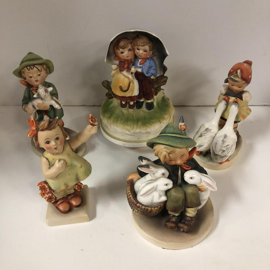 Lot of 4 Hummels and Music Box: This lot consists of Boy with Bunnies #58/1, Boy with Lambs #54, Girl with Flowers #72, Girl with Geese #47/0, and a vintage 1970 Music Box made by Chadwick Miller Sankyo Japan a Hummel-like item that