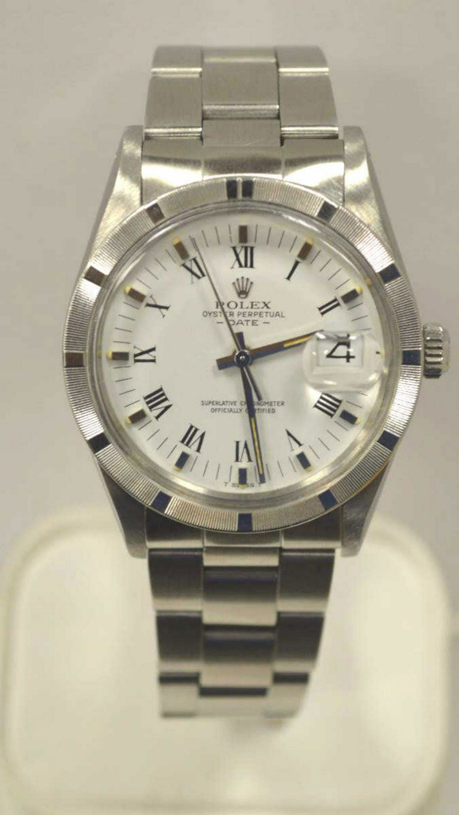 Men's Stainless Steel Rolex Date Watch: Men's Stainless steel Rolex Date watch, model #15010 featuring an automatic movement, roman numeral dial, engine tuned bezel, and oyster bracelet. Year 1982