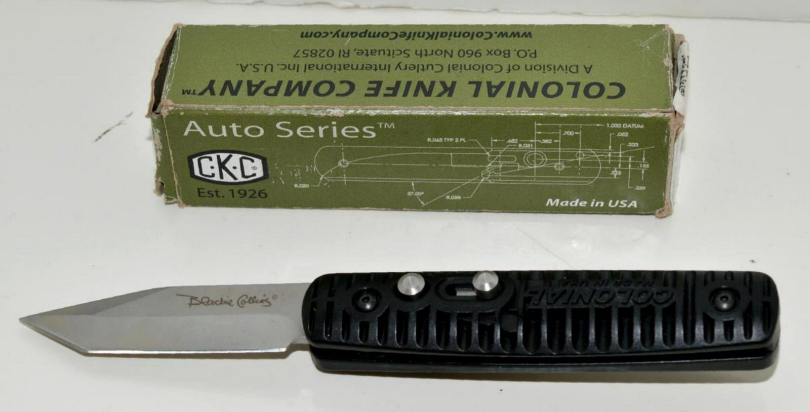 CKC Automatic Blackie Collins 107 U.S.A. Knife: CKC Automatic Blackie Collins 107 U.S.A. Knife in Box. Colonial Knife Company Auto Series BC107 tanto non-serrated signed blade in no-slip black handle, with stainless belt clip. Comes with box & orig