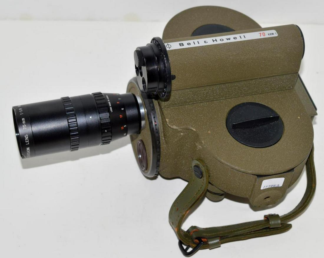 Vintage Bell & Howell 70-KRM-1 16mm Camera: Vintage Bell & Howell 70-KRM-1 16mm Motion Picture Camera. Olive drab green with matching leather trap. Hand wound portable adjustable exposure rate, footage counter. Up to three lens turret. On board