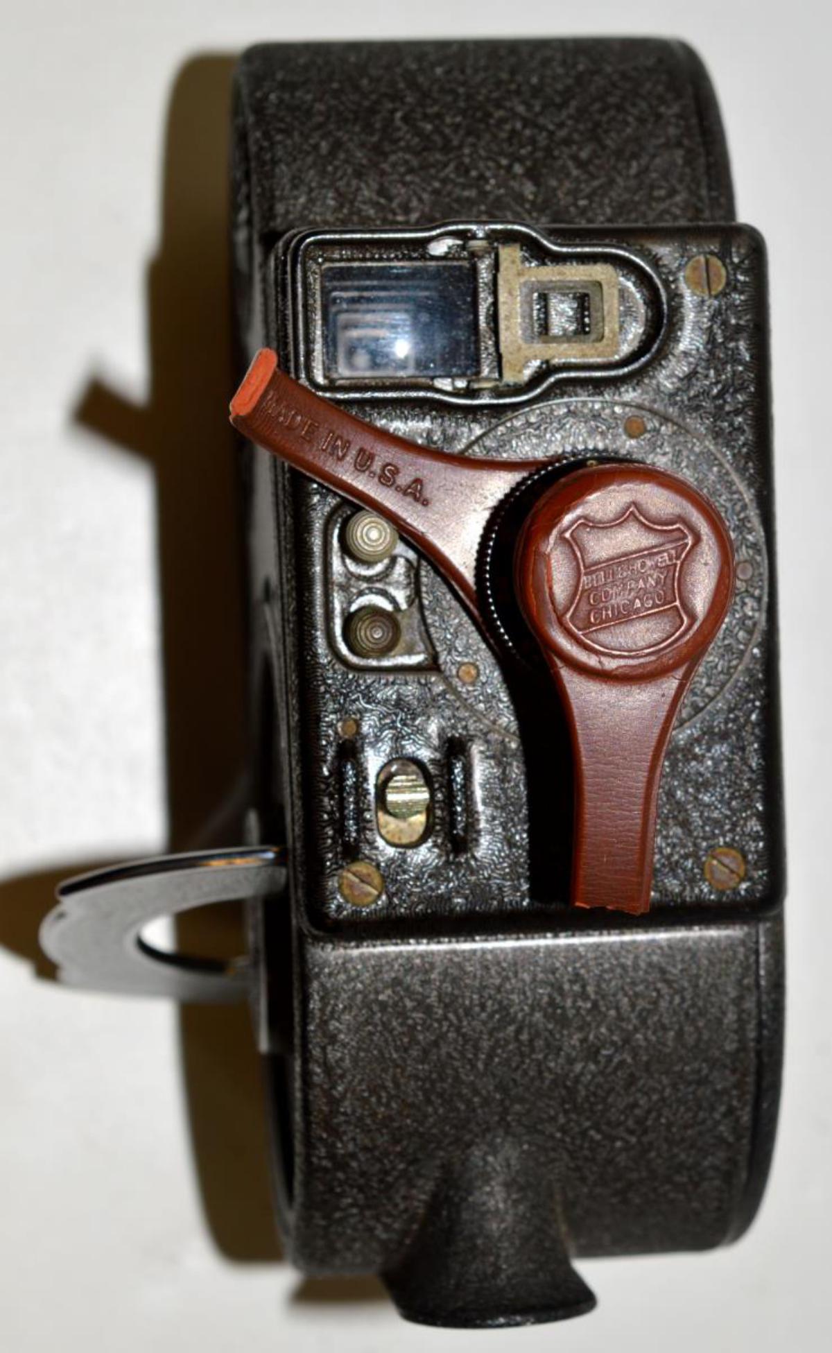 Vintage Bell & Howell Filmo 70DA 16mm Camera: Vintage Bell & Howell Co. Filmo 70DA 16mm Camera Made in the USA Cinemachinery. Spring drive, three lens turret, chrome winder handle, exposure rate adjustable, footage counter. Good brown finish is m