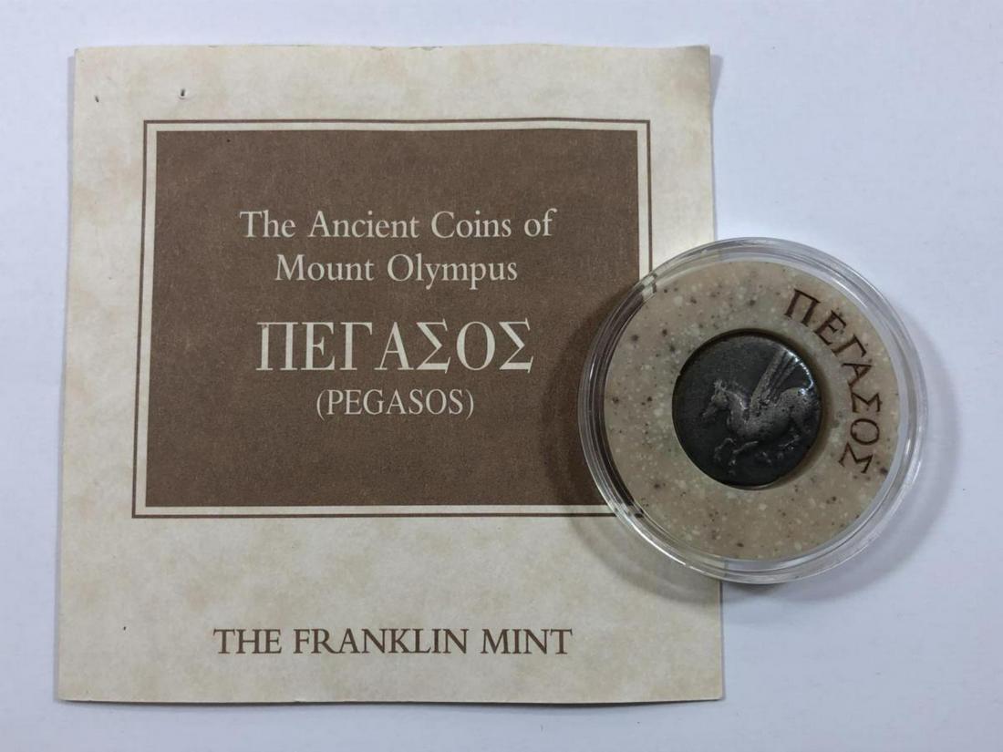 Mt. Olympus Ancient Coin Pegasos with Holder: Mt. Olympus Ancient Coin Apollo with Holder & COA. This Greek ancient coin features Pegasos, who was born from the severed head of Medusa, the monstrous snake-woman. Comes in a special ringed holder w