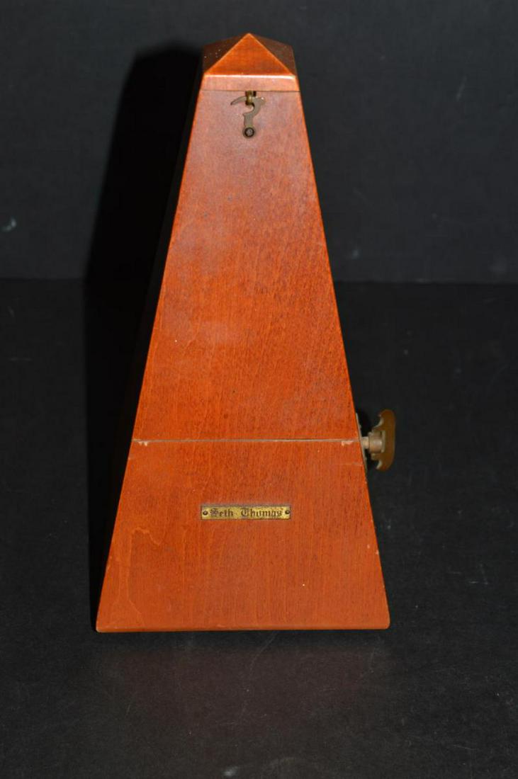 Seth Thomas Wood Metronome Fully Functioning: Seth Thomas Wood Metronome Fully Functioning in a wonderful wood cabinet. Seth Thomas name plaque is present on the front of the body. 9" tall & 4.5" base.