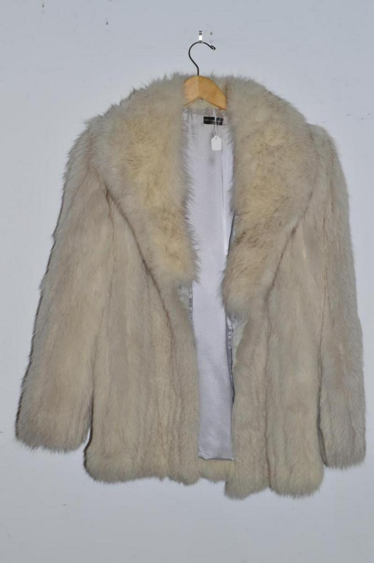 Ladies Blue Fox Fur Stroller Length Coat: Ladies Fully Lined Blue Fox Fur Stroller Coat Fully Lined in Size Medium. It is vertically striped with three front hook and loop closures. It has two front waist pockets. The hem to collar measuremen