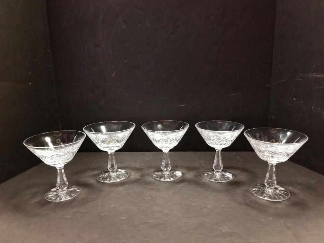 Lot of 5 Waterford Champagne Martini Glasses: Lot of 5 Waterford Champagne or Martini Glasses in the Colleen Pattern. The are approx. 4.75" tall, they are 4.25" diam. mouth. They have angular stems and are acid etched on the bottom with the iconi