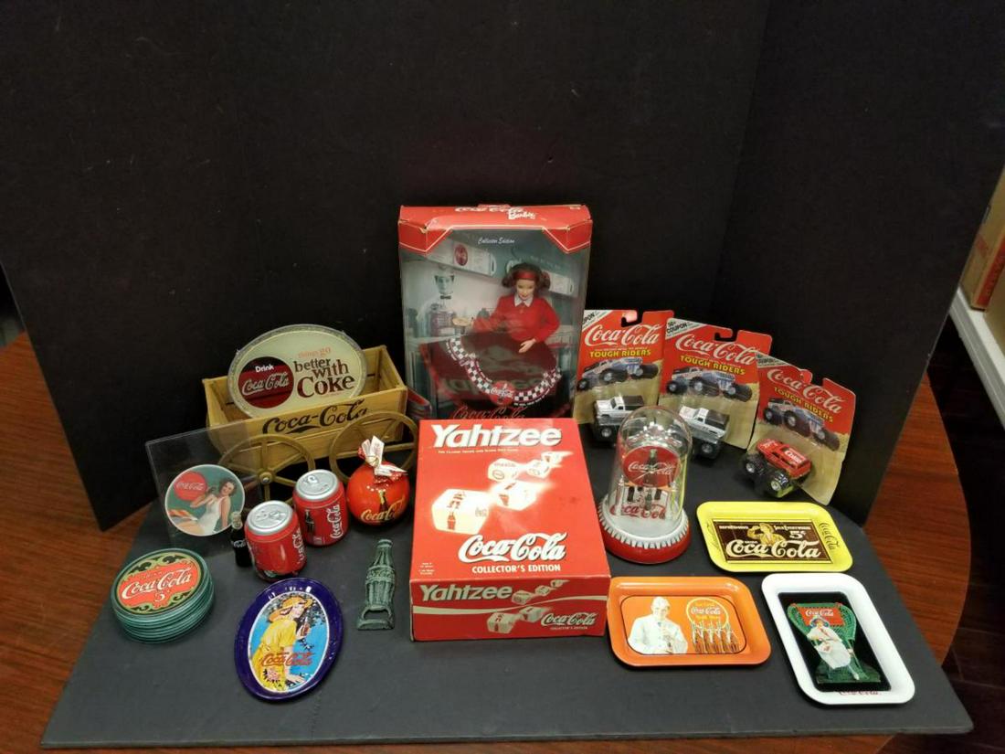 Large Collection of Coca-Cola Collectibles: Large Collection of Multi Era Coca-Cola Collectibles. This big assortment will include, Yahtzee, Mattel Barbie in box #24637, 3-mini Coke trays, quartz anniversary type clock, wooden wagon, Coke can s
