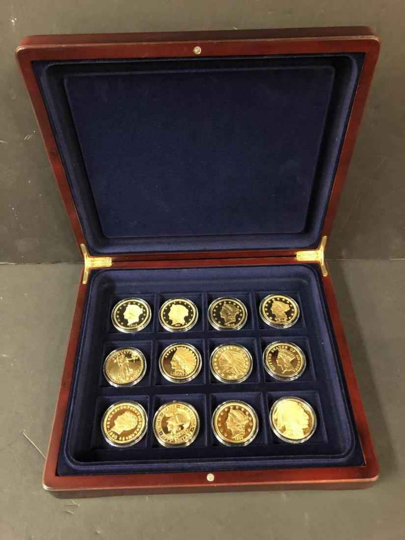 Display Case with 12 Replica Goldplated Medallions: Display Case with 12 Replica Goldplated Medallions. This felt-lined wood display case contains 12 1.5" gold plated replicas of famous coins. All are proof struck except for one.