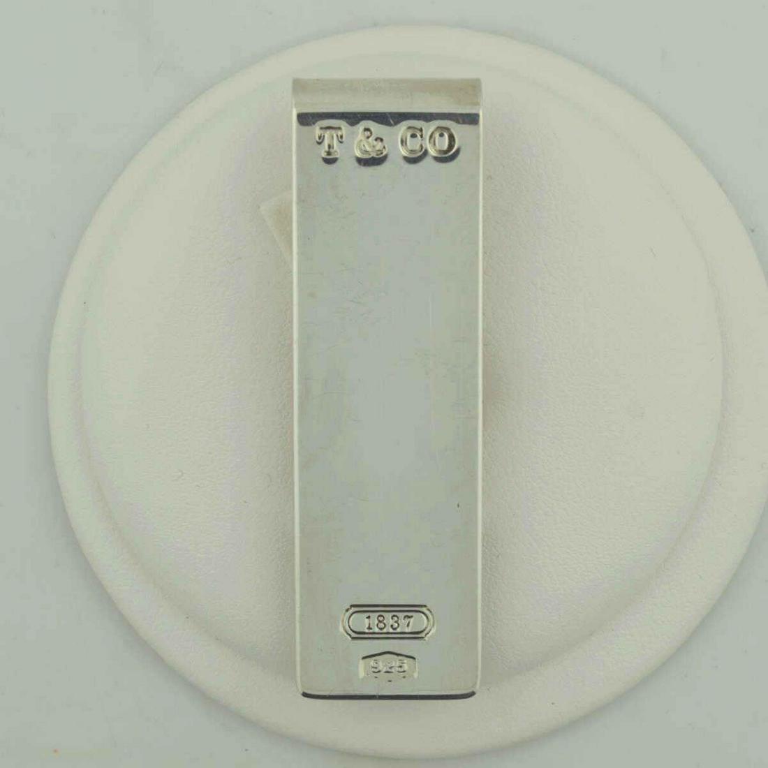 Tiffany & Co sterling silver money clip: Tiffany & Co. sterling silver 1837money clip measuring approx. 2.5 x 3/4". Weight 0.77 ozt.