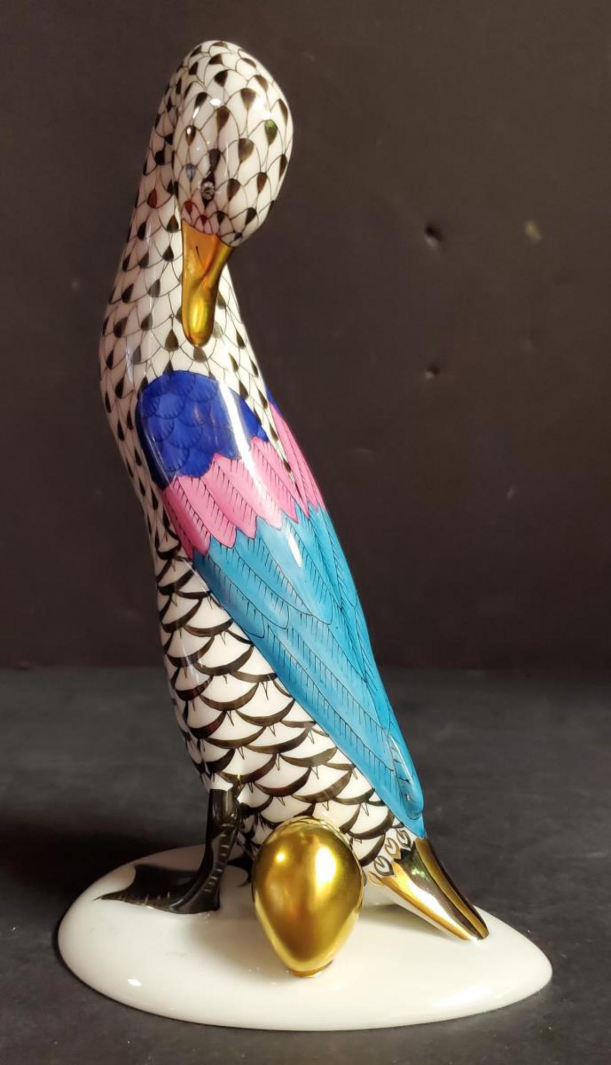 A Herend Hungary Porcelain Duck with Golden Egg: A Herend Hungary Porcelain Duck with Golden Egg #5936. This great porcelain collectible goose is 7.5" tall & is marked on the underside with the factory log & also 5936\VHNM G94. This great gold gilt