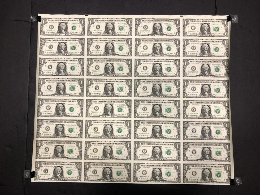 Series 2009 $1 Uncut Sheet of 32 Currency Notes: Series 2009 $1 Uncut Sheet of 32 Currency Notes. Thre are 32 2003 One Dollar George Washington Federal Reserve Notes to this uncut sheet. Currently rolled, it does have a few crinkles in it, but no te