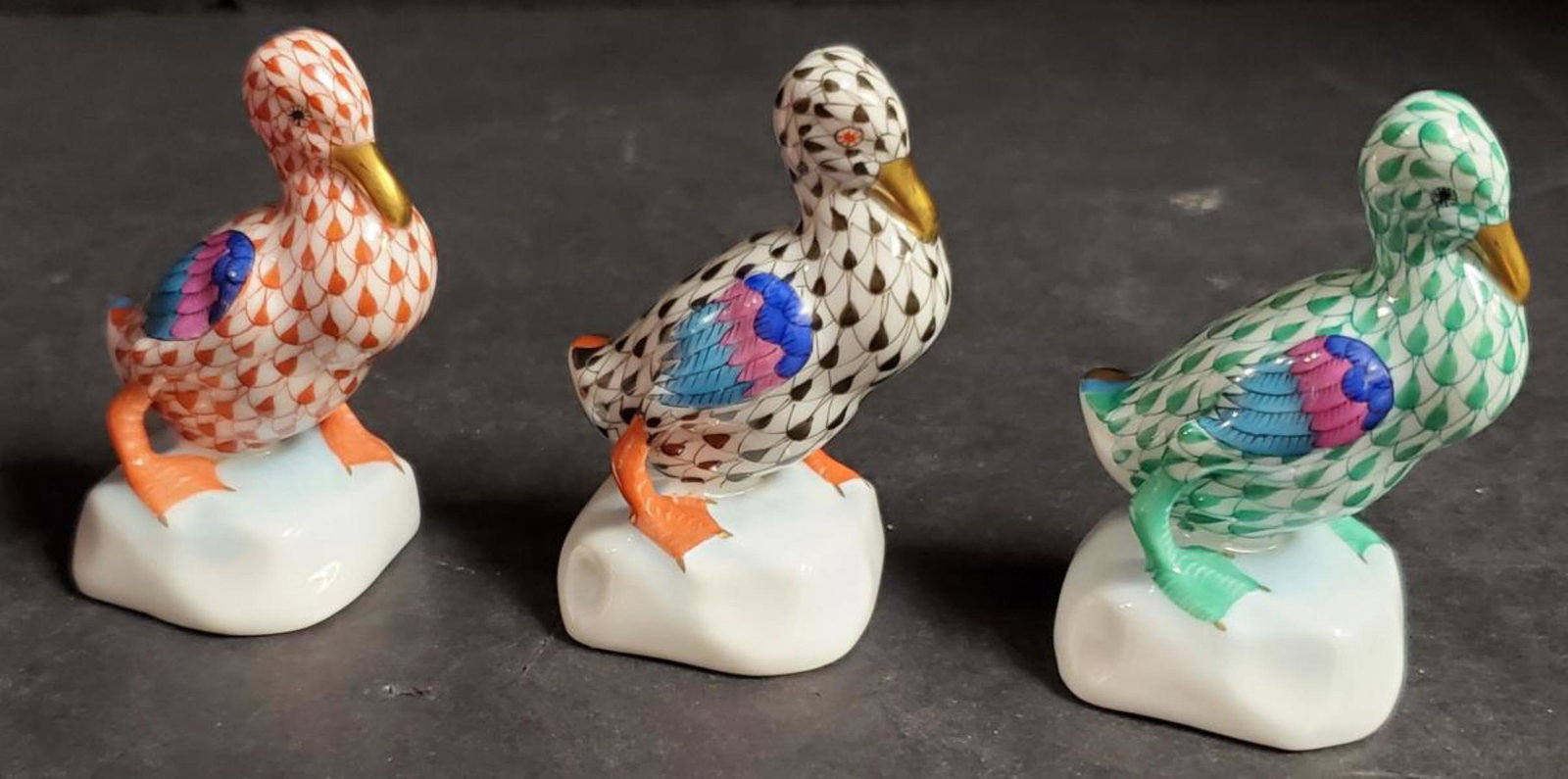 Herend Hungary Hand Painted Porcelain Duck Trio: A Colorful Trio of Herend Hungary Hand Painted Porcelain Duck Figurines. Figurines #5022. This group of great ducks are very colorful & each one is differently patterned with gold gilt bills. They are
