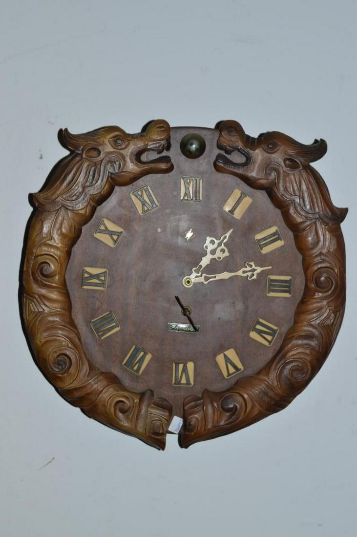 Vintage Round Wooden Dragon Clock by Frontier: Vintage Round Wooden Dragon Clock by Frontier. This fun wall hanging timepiece is likely home made or modified or retrofitted. It has wooden dragon half round applications arching up towards brass ton