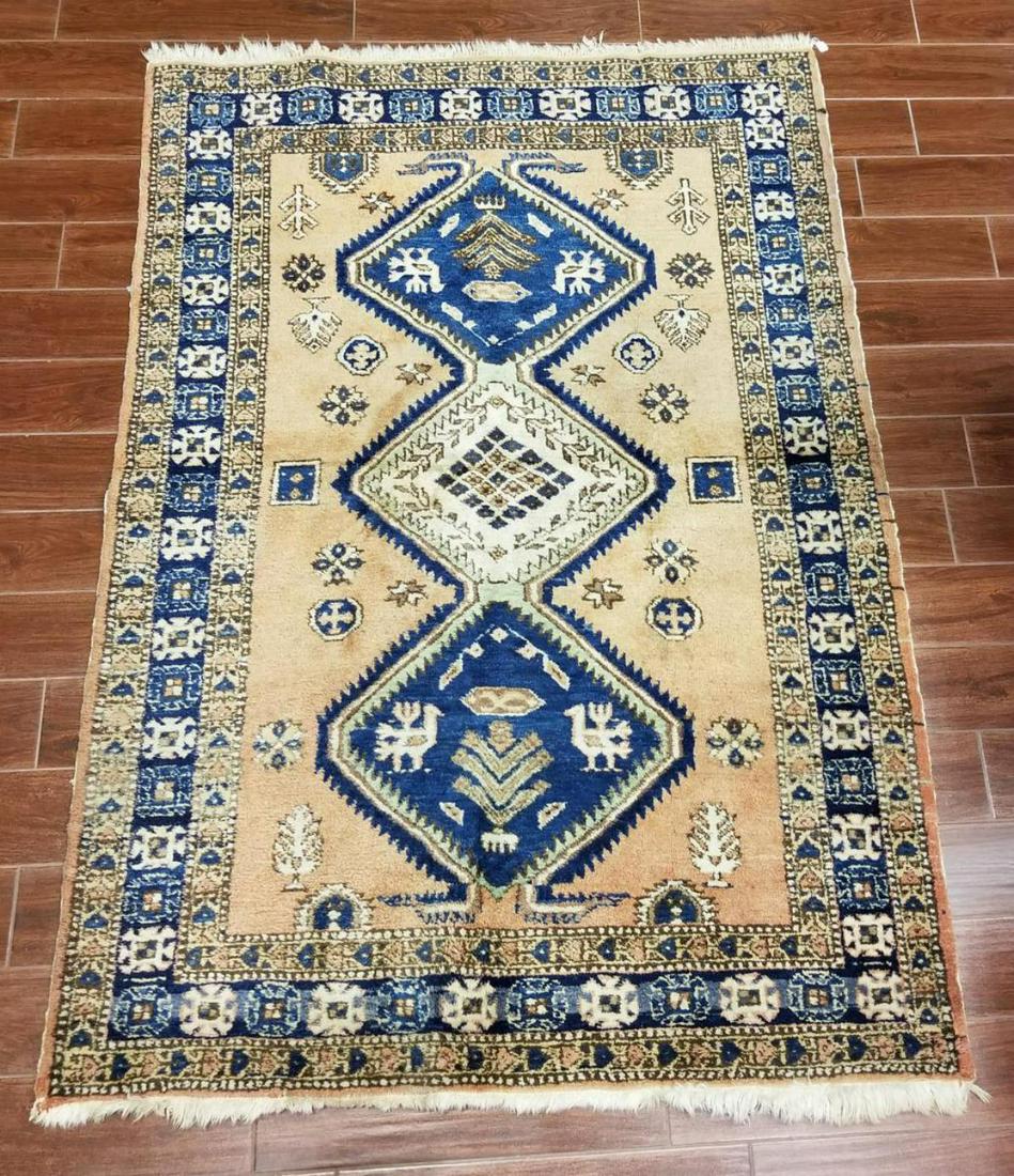 Vintage Persian Area Rug 54" x 76" Plus Tassels: Vintage Persian Area Rug 54" x 76" Plus Tassels. Peach, blue, beige, brown. Good condition. Early to mid 1900's. Some stains are evident on a few of the tassels.