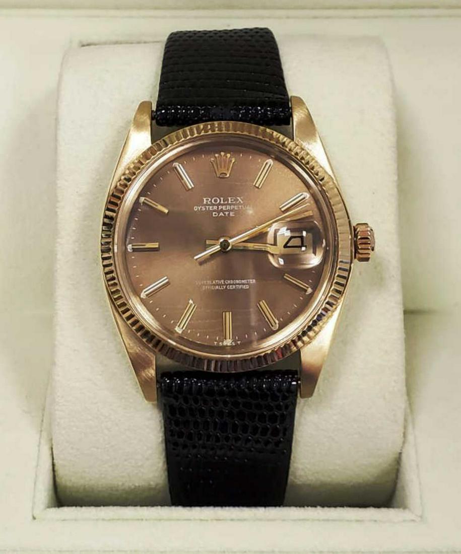 Men's Vintage 14kt yellow gold Rolex Date Watch: Men's vintage 14kt yellow gold Rolex Date watch, model #1503, featuring a 14kt yellow gold case, with brown toned dial, stick markers, acrylic crystal, automatic movement, and generic black leather ba