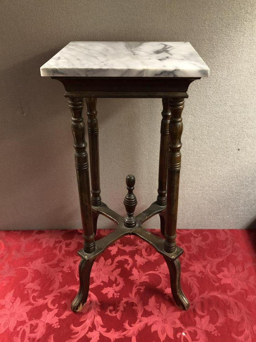 White Marble Top and Wooden Stand Side Table: White Marble Top and Wood Spindle Stand Side or Parlor/Foyer Table. Could also be used as an indoor plant stand. 30 " tall.
