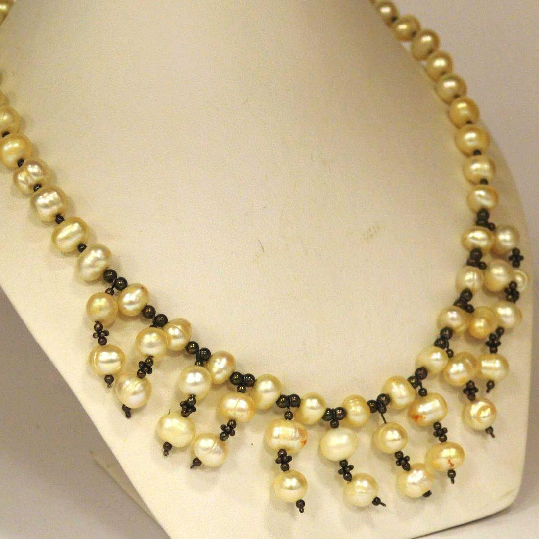 Ladies Baroque Fresh Water Pearl Necklace: Ladies pearl necklace featuring baroque fresh water pearls ranging in size from approx. 5mm-9mm. Separated by silver toned beads. Length 16"