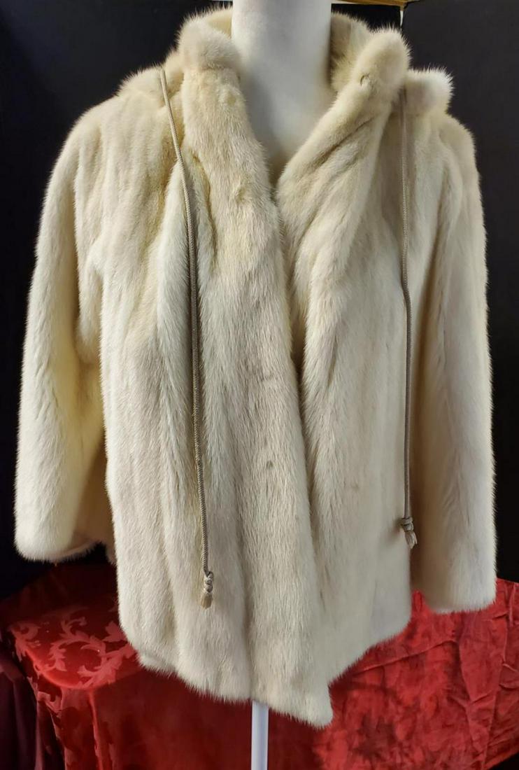 Ladies Mink Fur Hooded Cape Cream Colored: Ladies Fully Lined Cream Colored Mink Fur Removable Hood Poncho Cut Cape. This great fur is from Flemington Furs of New Jersey. It is in excellent condition & features a 3 button removable, drawstring