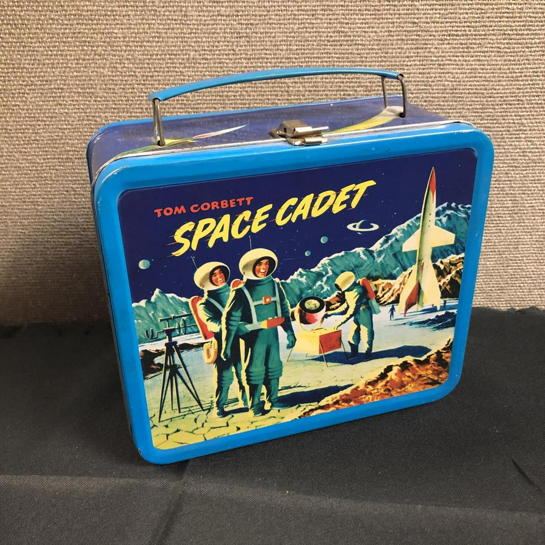 Vintage Tom Corbett Space Cadet Metal Lunchbox: Vintage Tom Corbett Space Cadet Metal Lunchbox. This lunchbox has a few minor scratches, but no dings or major faults, and looks new inside. Measures 8" x 7" x 3 7/8". Tom Corbett is the main characte