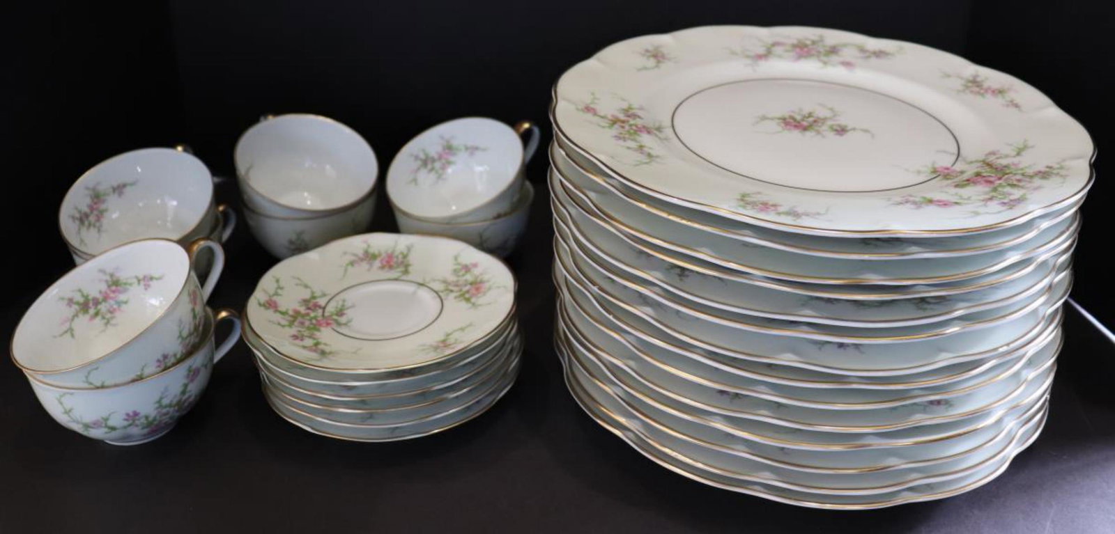 28 Pieces of Theodore Haviland Rosalinde China: 28 Pieces of Theodore Haviland Rosalinde China (New York/France). Includes: 14 Dinner Plates (10 1/2"), 6 Saucers (5 1/2") 1 Has Small Chip & 8 Cups (2"h). Discontinued in 1993.