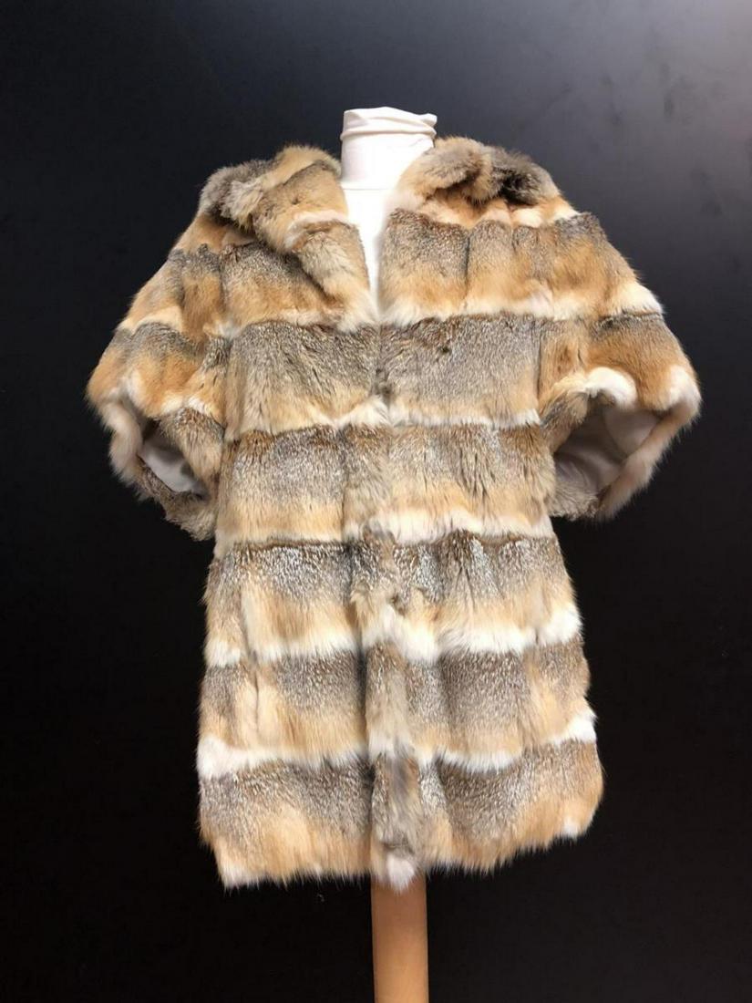 Ladies Rabbit Fur Coat by Szor-Diener Furs Canada: Ladies Rabbit Fur Coat by Szor-Diener Furs Grosvenor Canada. Multi colored sleeveless fur coat. Lots of intense color changes in horizontal stripes. Medium size approx. with two waist pockets and 4 ho