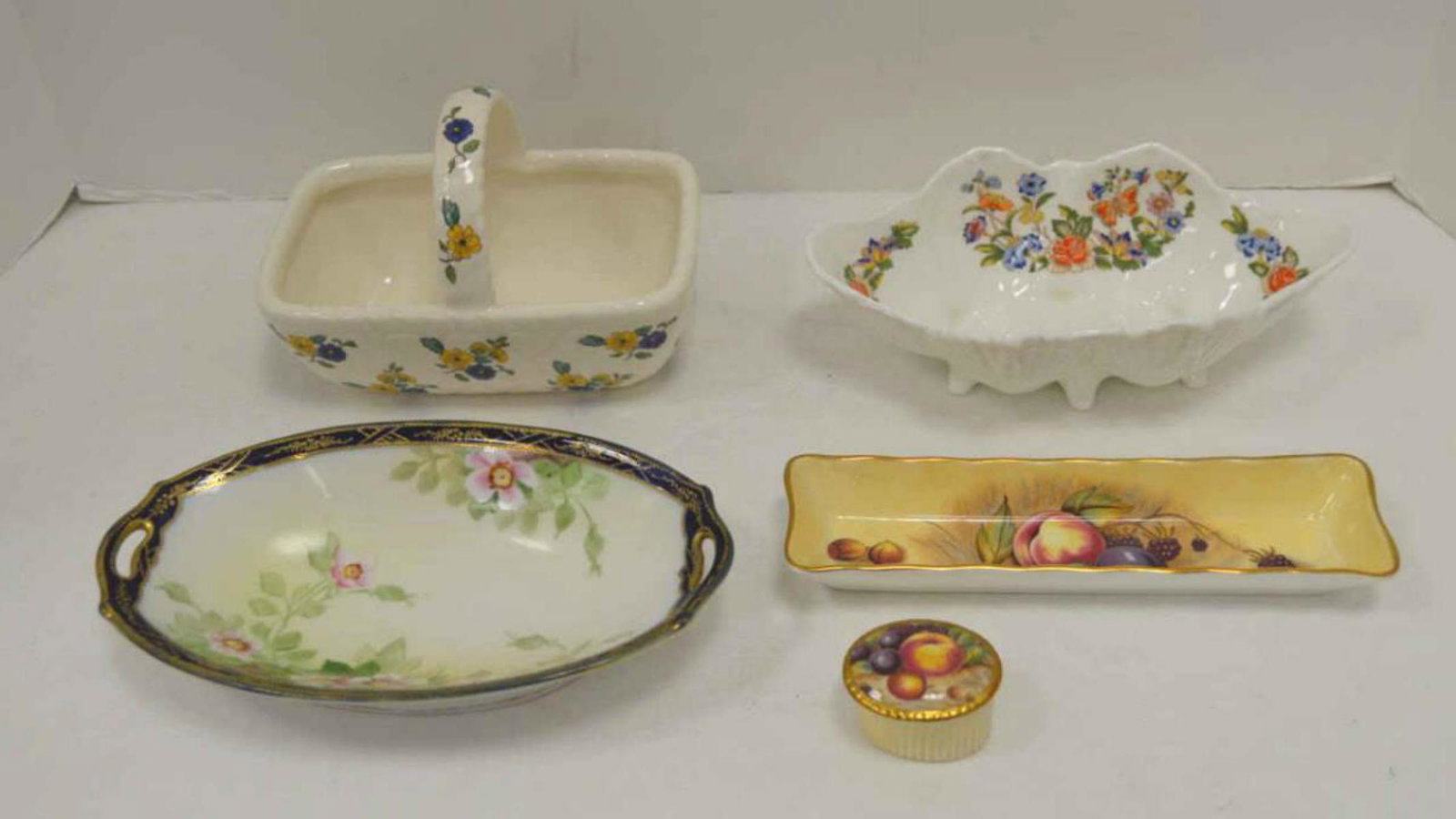 4 pieces of porcelain: 4 pieces of decorative porcelain. Lot includes basket made for Elizabeth Arden, and 3 pieces by Aynsley.