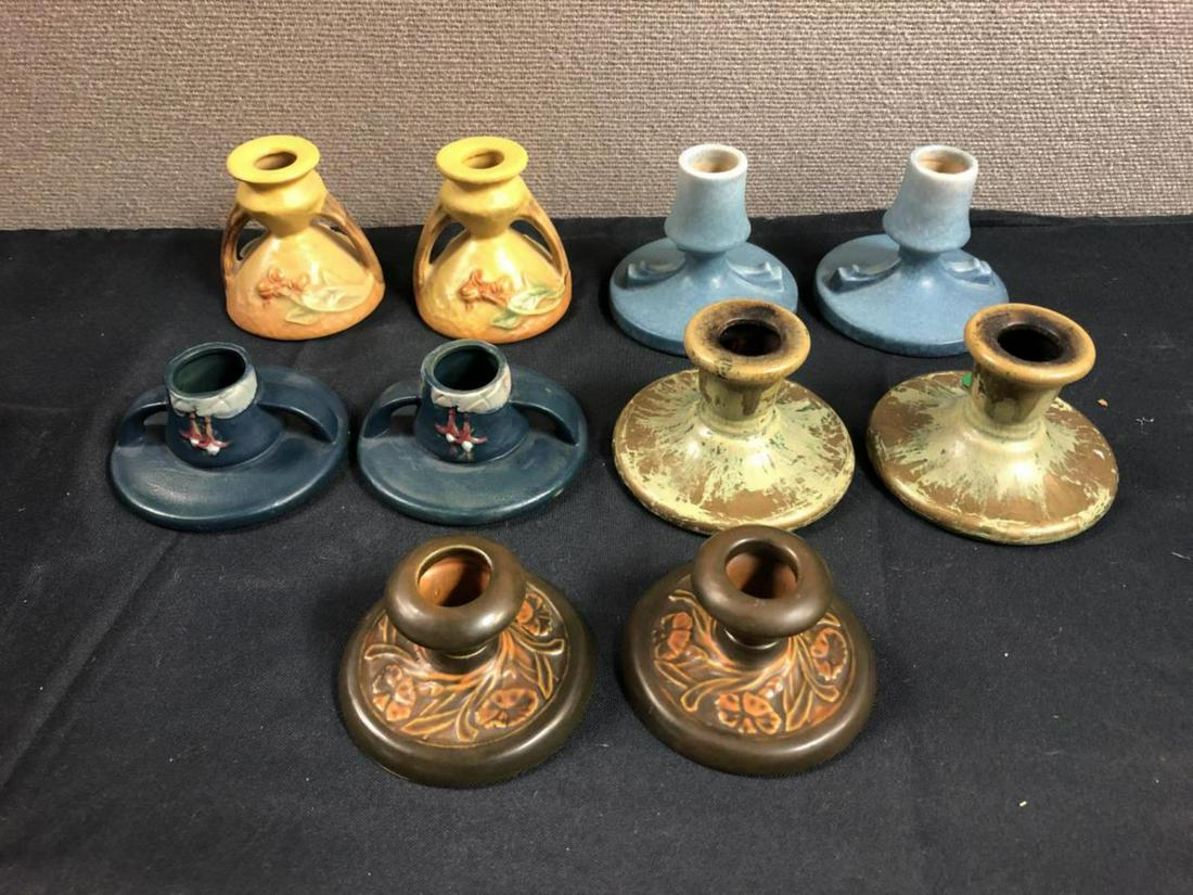 5 Pairs Vintage Roseville Pottery Candle Holders: 5 Pairs of Vintage Roseville Pottery Candle Holders. Marks Include Blue Rv, Roseville, & Roseville USA. Size: 2"-3 1/4" High.