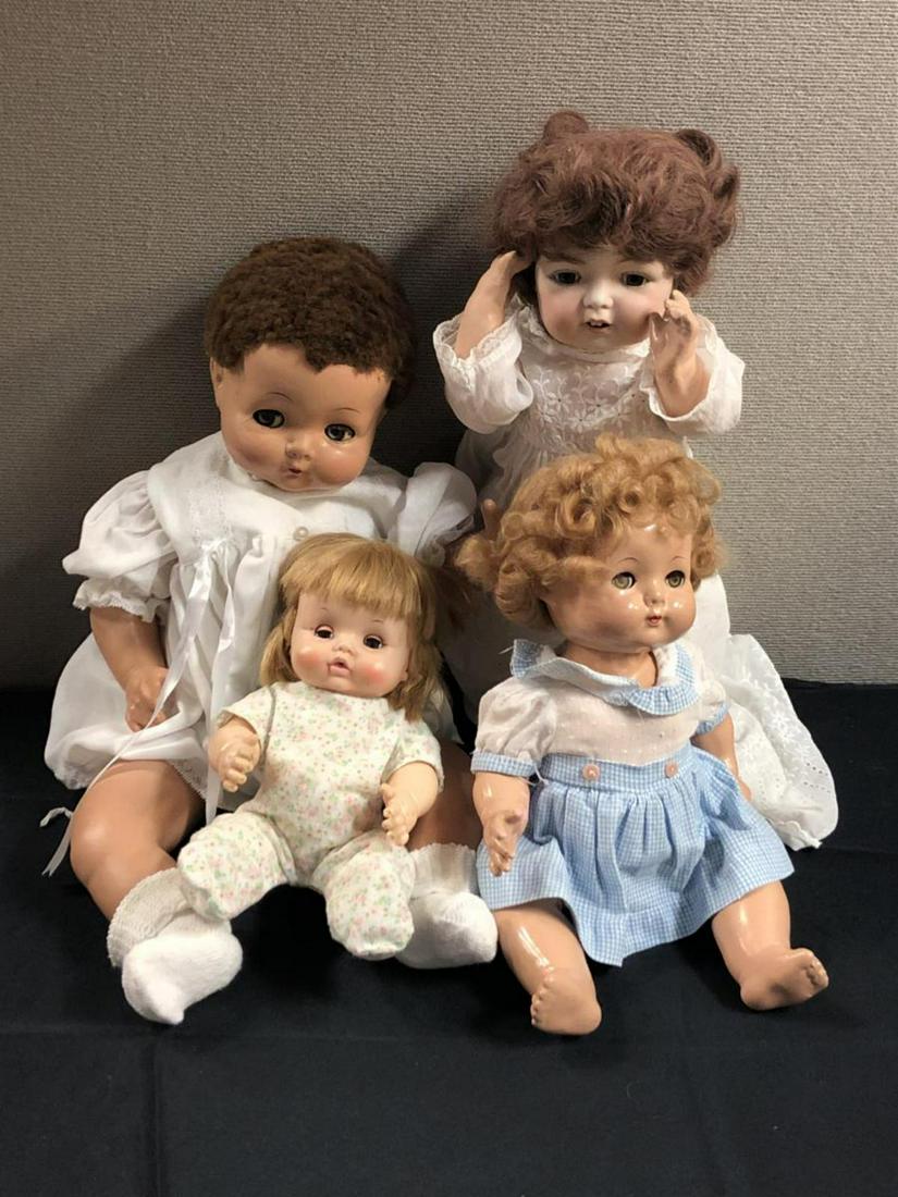 Lot of 4 Vintage Effenbee Dolls 24" to 12": This lot contains 3 Effenbee dolls and one of unknown maker. The largest one is Effenbee, is jointed and has moving eyes. Some hair is missing and some crazing is noted. The doll in the blue polka dot