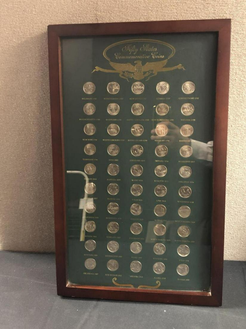 Glass Framed 50 State Quarter Commemorative Set: Glass Framed 50 State Quarter Commemorative Set contains 1 each of the 50 different Statehood quarter issued between 1999 and 2008. Housed in a wood framed box with glass cover, ready for hanging as i