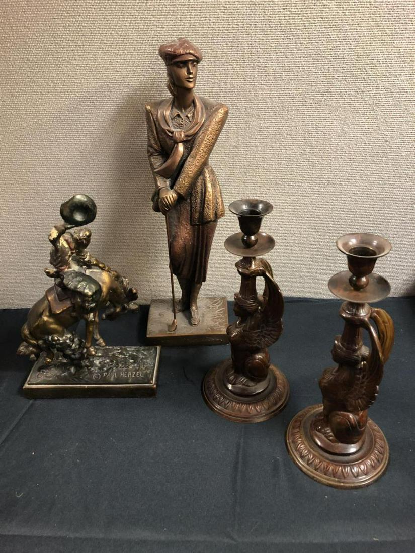 Pair Of Bronze Statues & 2 Candle Holders: 2 Candle Holders & Pair Of Bronze Statues. Candle holders are Antique copper material. Stands 10 1/2" tall. Bronze Guy riding a bull. Paul Herzel name on base of statue. Stands 11 1/4" tall. Female Go