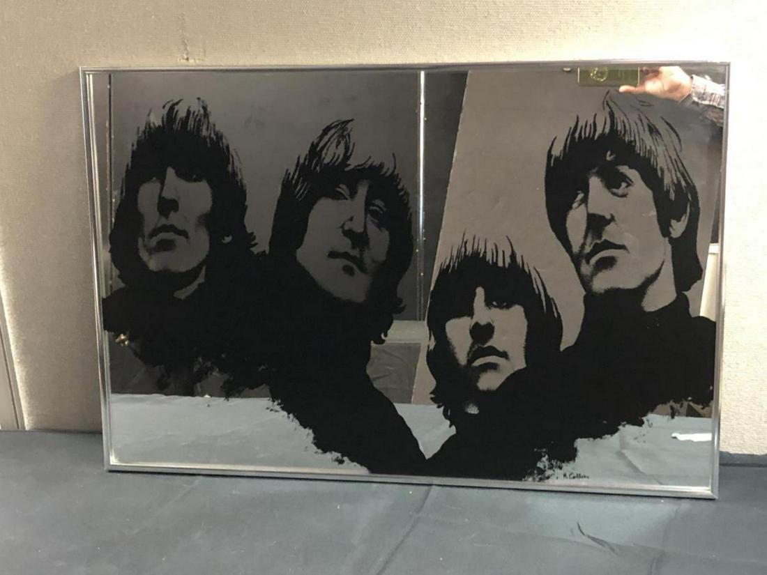 The Beatles "Rubber Soul" Promotional Mirror: Scarce promotional mirror, 20" x 30", depicting the Beatles as they appear on the cover of their 1965 album "Rubber Soul". The artist's name "M. Collie" appears at the bottom edge, while the reverse i