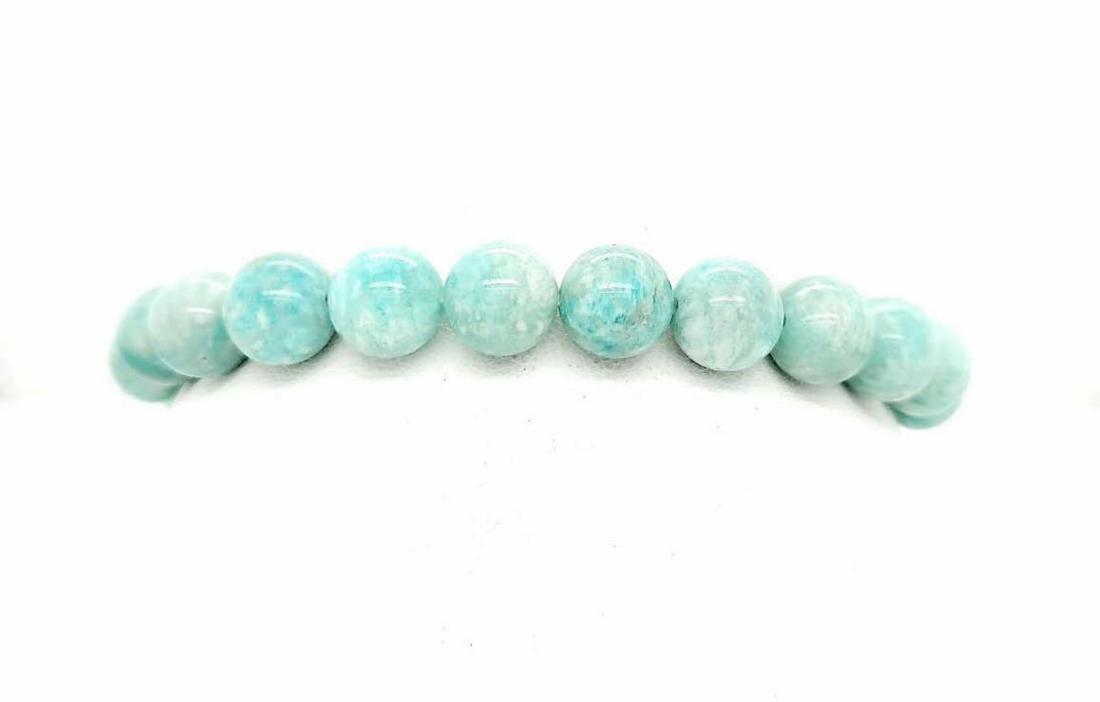 Amazonite bead bracelet: Ladies amazontie bead bracelet featuring 10mm greenish blue amazonte beads strung on elastic string. Length approx. 8".