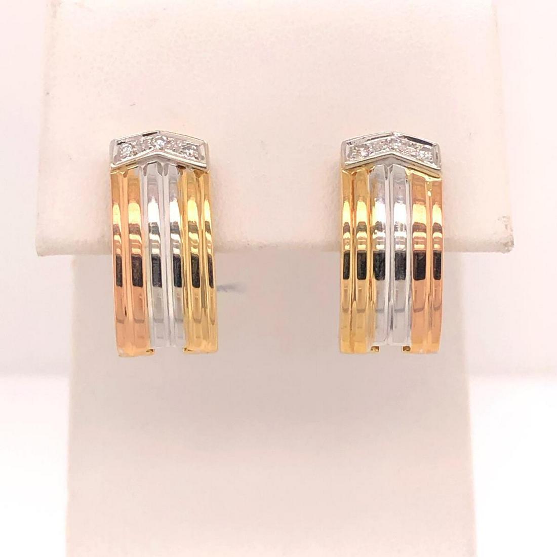 18kt tri-color diamond hoop earrings: Ladies 18kt yellow , rose and white gold diamond earrings featuring prong set round brilliant cut diamonds weighing approx. 0.06ct. Accented with a ridged texture and finished with omega backs. Weight
