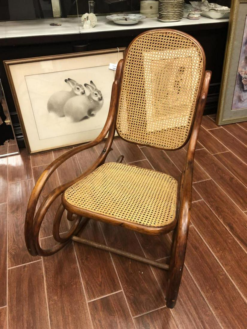 Vintage Wood Wicker Rocking Chair: Vintage Wood Wicker Rocking Chair. Measures 34" high and 19" across. Rocking chair in great shape.