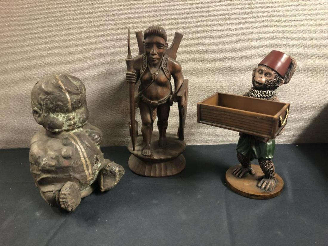 Lot Of Wood & Metal Sculptures: Lot Of Wood & Metal Sculptures. Total of 3 Pieces in the lot. Consists of metal baby boy sitting standing 10" tall. Wooden Tribal man with spear & shield along with baby pig standing 12 1/2" tall. Met