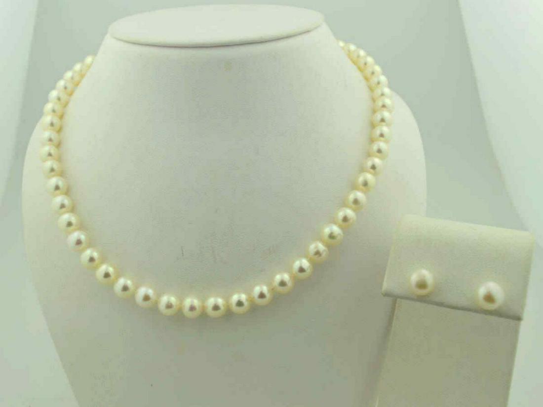 18" strand of freshwater pearls and earrings: Ladies 18" strand of freshwater pearls featuring single knotted 7mm creamy white color baroque pearls. Also includes matching stud earrings