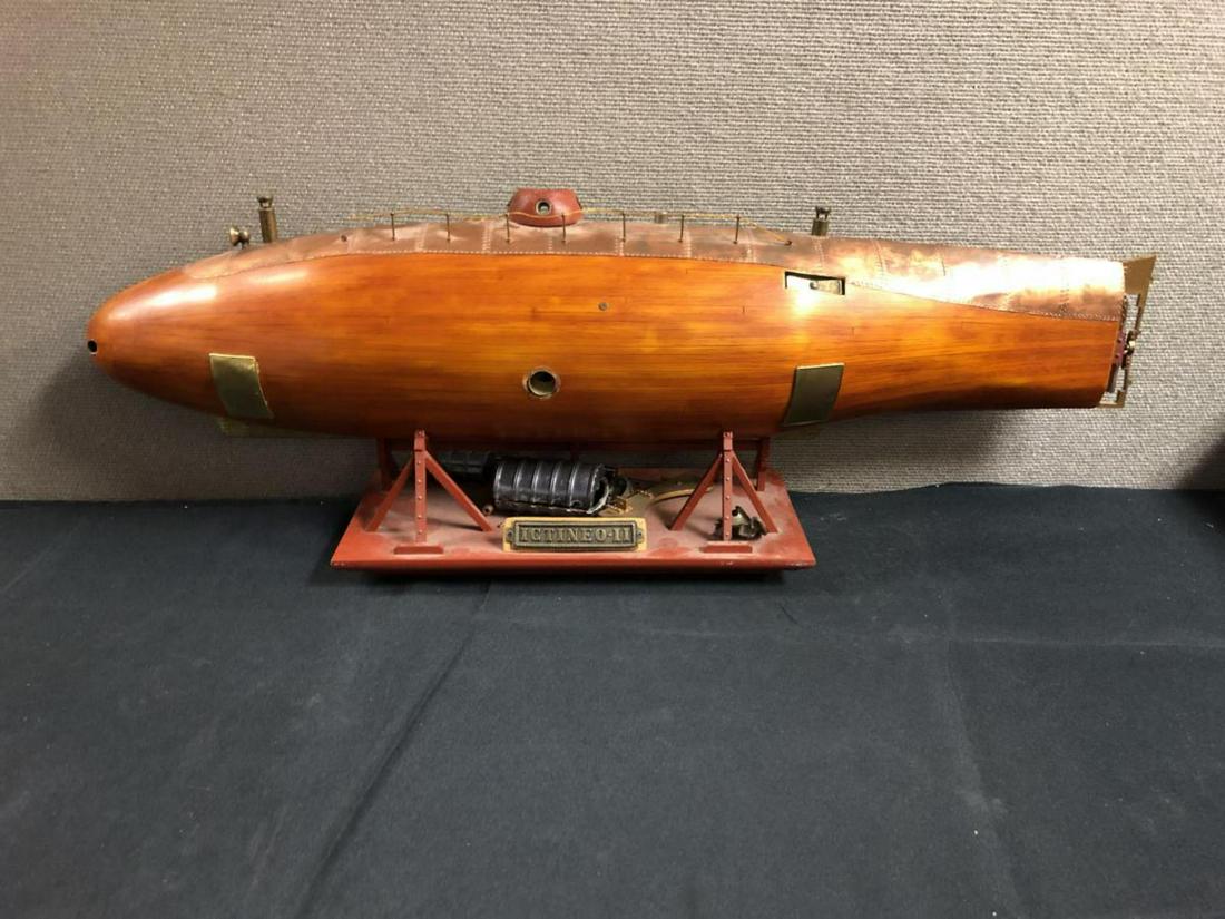 3-D Cut Out Submarine ICTINEO-11: 3-D Cut Out Submarine ICTINEO-11. Loose pieces accompany the Submarine. Measures 9 1/2"x27 1/2". Pioneering Submarine launched in 1864 by the Spanish Engineer Narcis Monturiol. Powered underwater Navi
