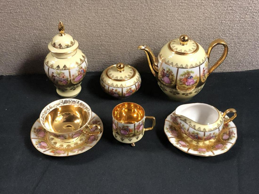 Royal Vienna Love Story Tea Set: Royal Vienna Tea Set. Made in Germany. 8 total pieces in the lot. Consists of 1 Teapot. 1 Tea cup. 1 Espresso cup. 1 sugar. 1creamer. 2 saucers. 1 small urn. Love Story Hand painted. Hallmark on botto