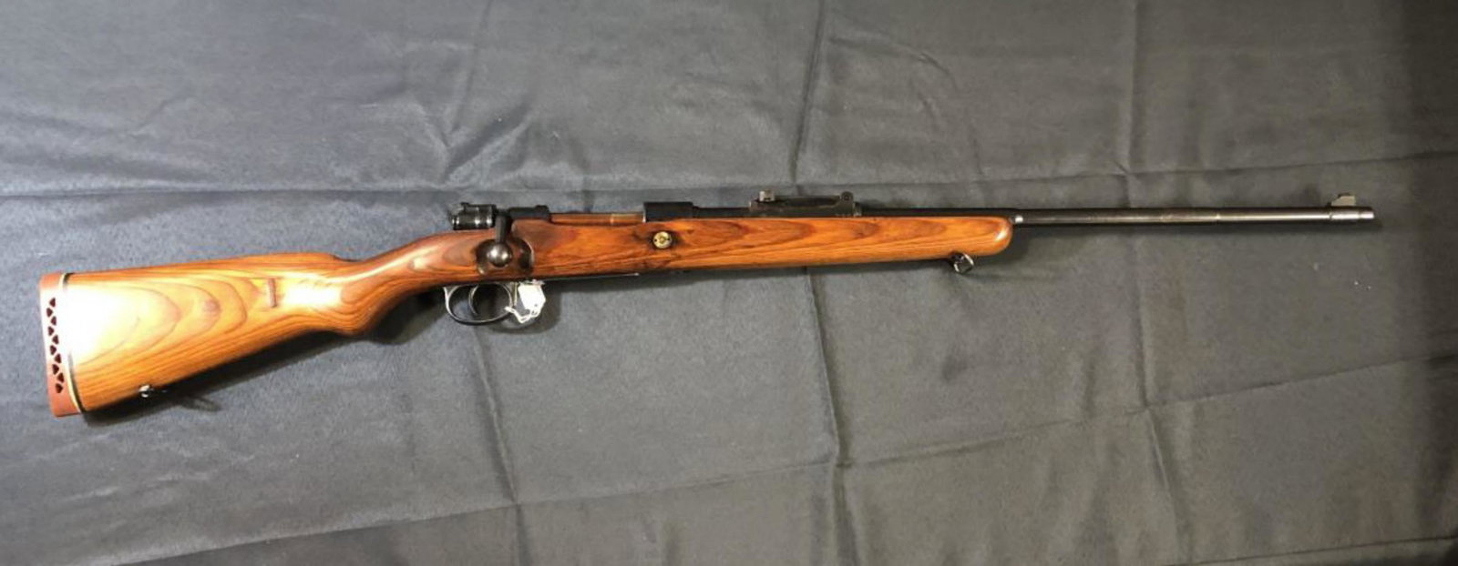 Mauser Model 98 Bolt Action Rifle in Sporter Stock: Mauser Model 98 Bolt Action Rifle in Sporterized Stock. The workhorse of the German WW I military. This great rifle has a 23 1/4" blue barrel with elevation rear sights & ramp front sight. The receive