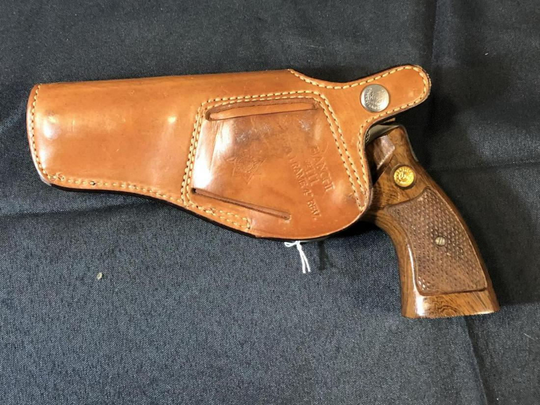 Taurus M# 65 Satin Nickel 4" .357 Mag Revolver: Taurus Model # 65 Satin Nickel 4" Shrouded Barrel .357 Mag Double Action Revolver with Wood Two Piece Checkered Original Grips. 6 Round Cylinder with leather Bianchi #111 holster. Serial Number 54449.