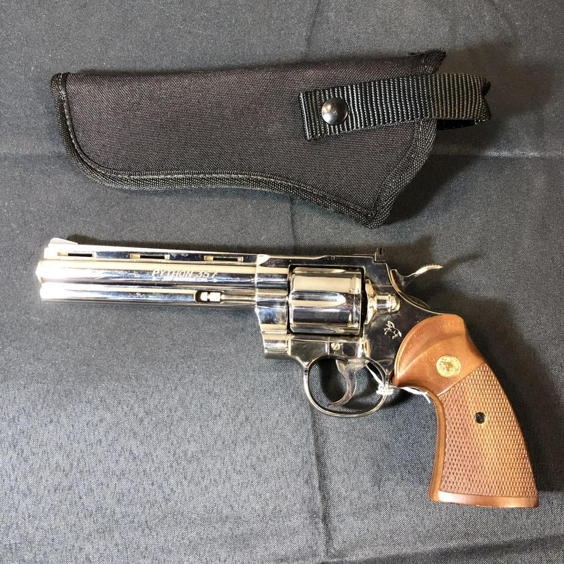 Colt Python 6" 357 Mag Revolver Polished Nickel: Colt Python 6" Barrel .357 Magnum Revolver in the Polished Nickel Finish, Vented Rib, Fully Shrouded. Manuf. 1981, checkered wood grips with gold medallion inset. Great condition. 6 round, double acti