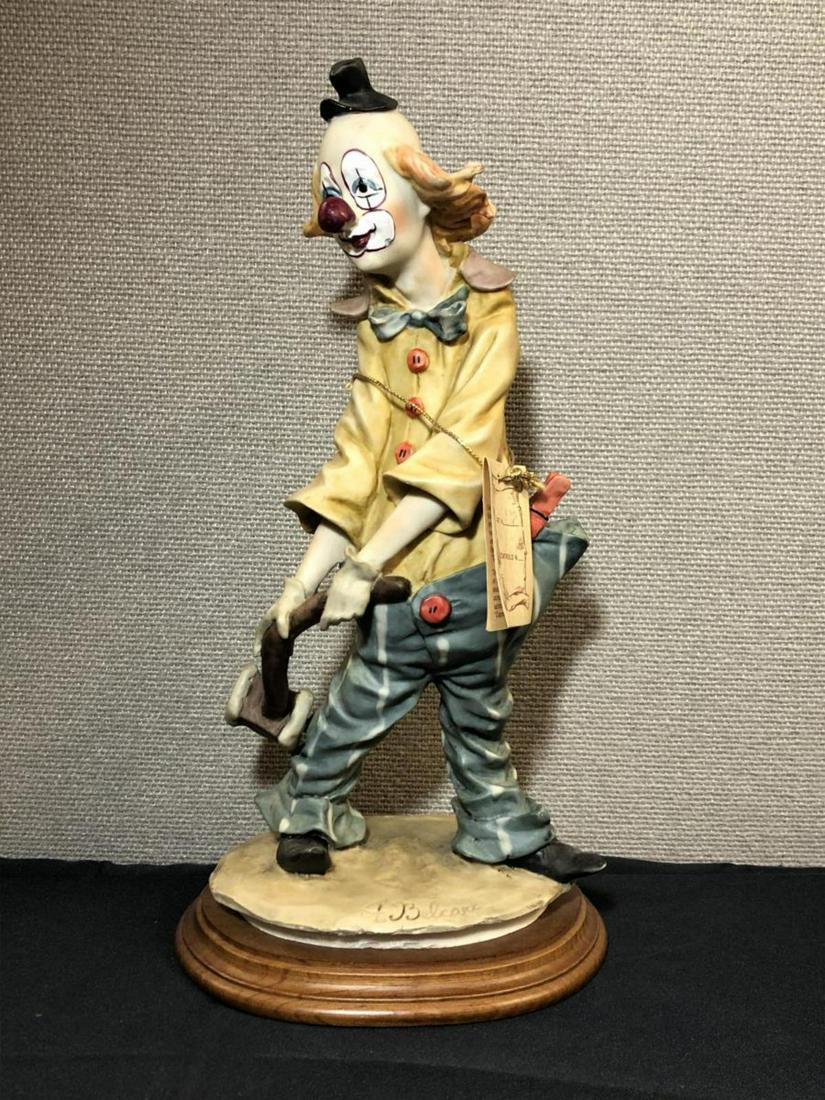 Capodimonte Clown Sculpture by A. Belcari with COA: Capodimonte Clown Sculpture by A. Belcari with COA Hang Tag with Hand Numbering Crafted in Italy. This fun vintage collectible was is signed in the porcelain part of the base. it is displayed & attach