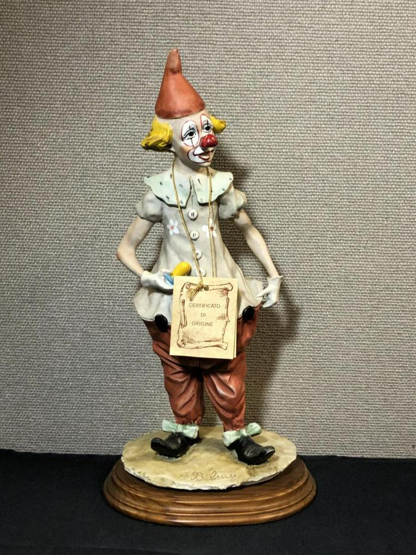 Capodimonte Clown Sculpture by A. Belcari with COA: Capodimonte Clown Sculpture by A. Belcari with COA Hang Tag with Hand Numbering Crafted in Italy. This fun vintage collectible was is signed in the porcelain part of the base. It is displayed & attach