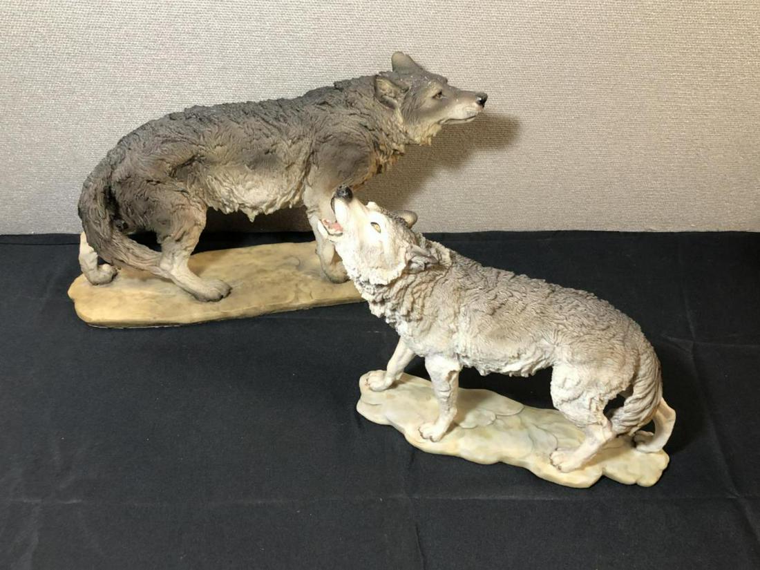 Pair Of Wolves Sculpture Figurines: Pair Of Wolves Figurines. Made out of some type of resin. Larger Wolf stands 11" tall and measures 16" across. Smaller wolf stands 10 1/2" tall and measures 13" across.