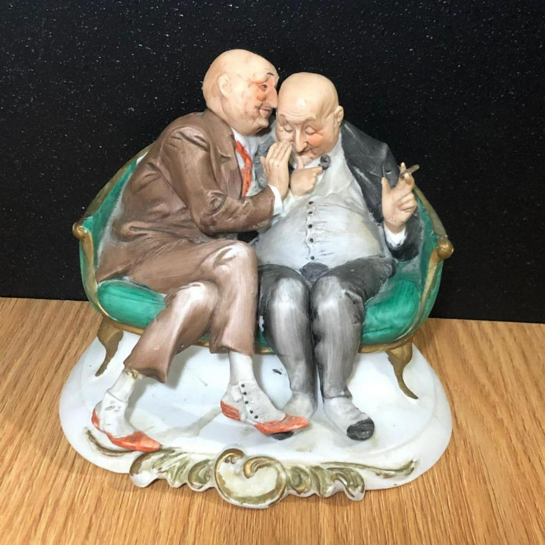Capodimonte Cappe Porcelain Music Box "The Joke": Capodimonte Cappe Porcelain Music Box "The Joke" This music box features two old men telling a joke. It is a music box, with an off slide on the back. Bottom has twist, and it does work. Bottom also f